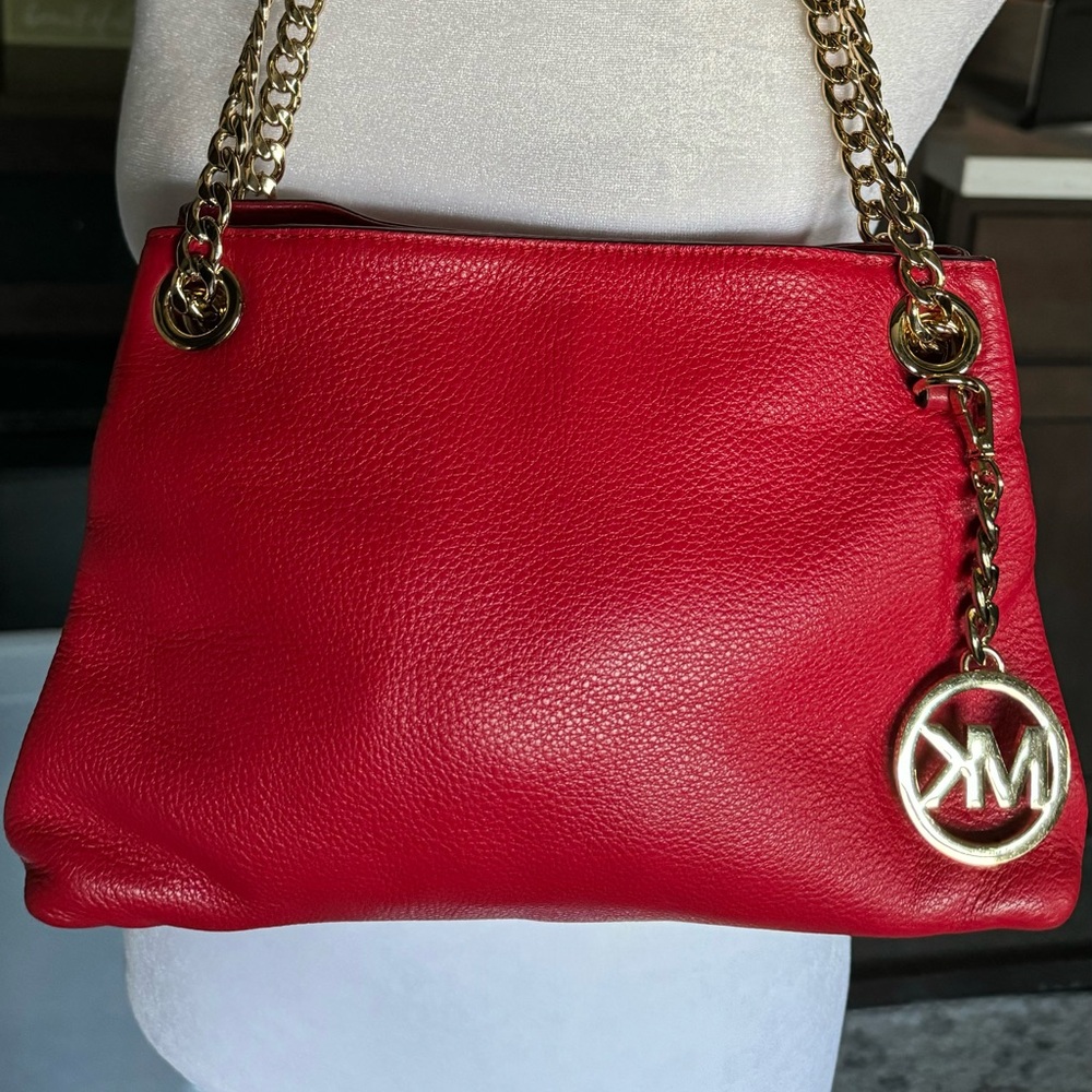 PRICE CUT!   SOME COLOR TRANSFER..Michael Kors red shoulder bag